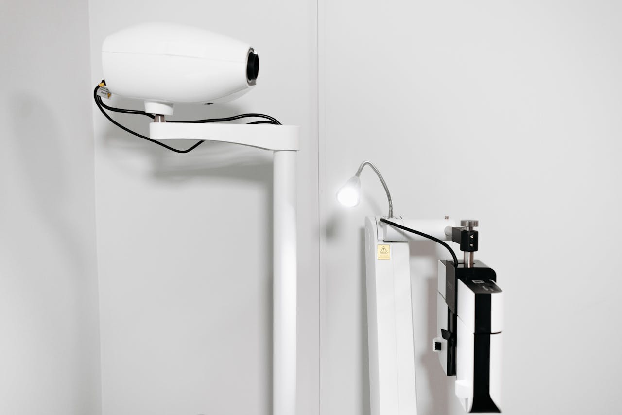 Close-up of sophisticated medical equipment in a pristine white room.